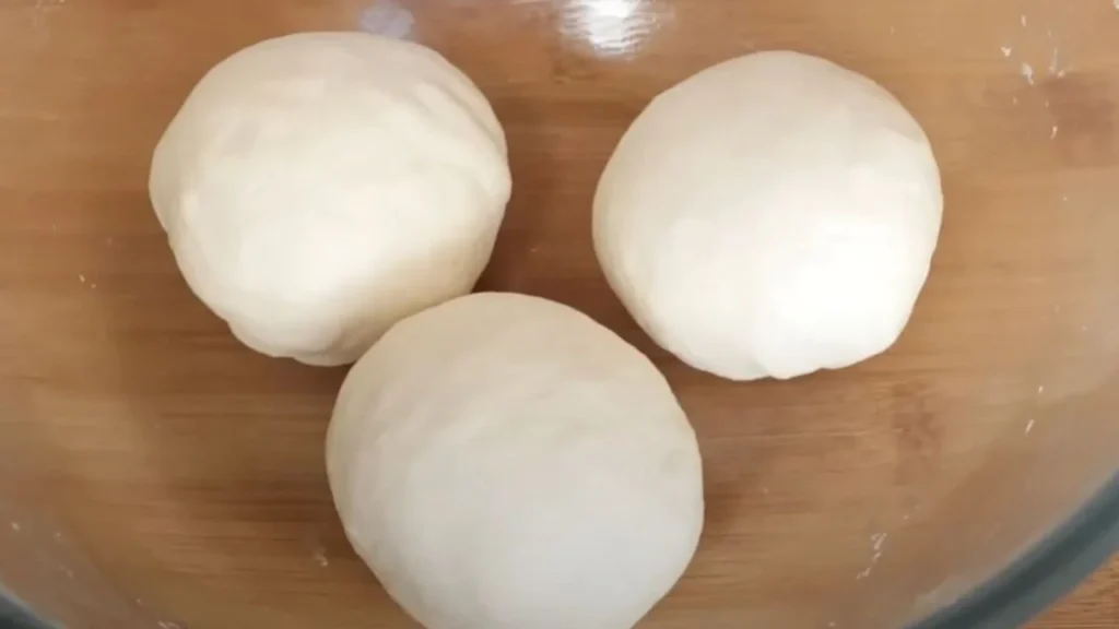 a group of white balls on a wooden surface, veg quesadilla recipe